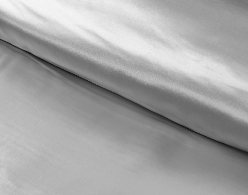 Close-up of our smooth 100% silk fabric on our Silk Duvet Cover in Silver.