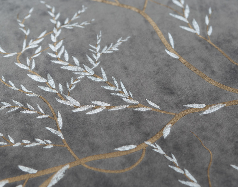 Close-up of the delicate gold branch pattern and white leaves on our Stella Duvet Cover.