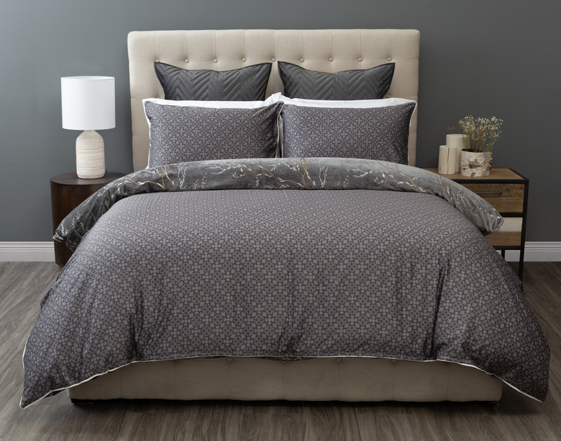 Front view of the block pattern reverse on our Stella Duvet Cover dressed over a bed in a dark grey bedroom.