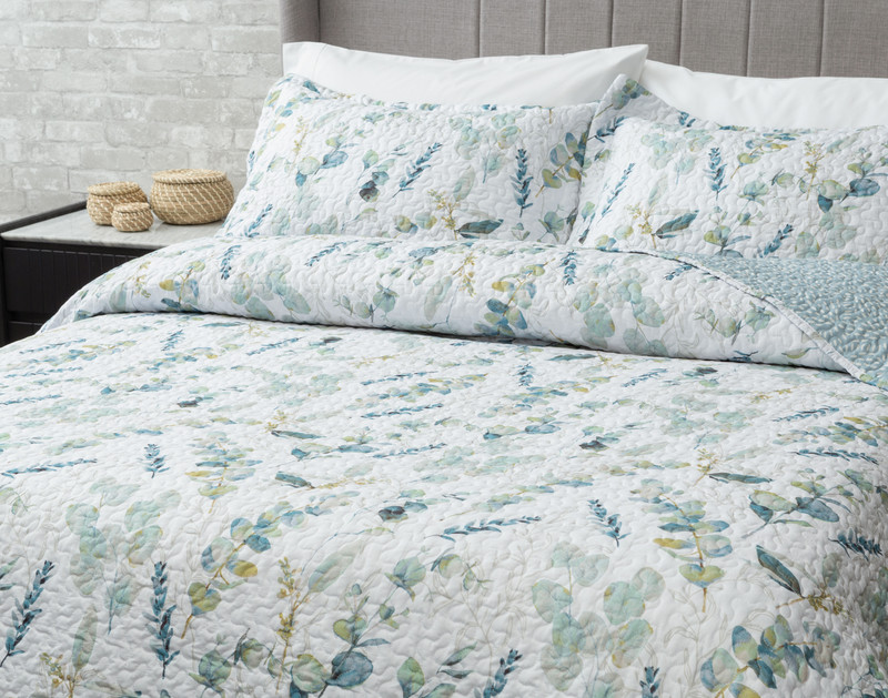Angled view of our Ariel Coverlet Set with its detailed watercolour florals.