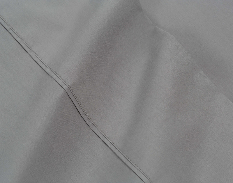 Hemmed edge on the flat sheet for our Cotton Percale Sheet Set in Grey.