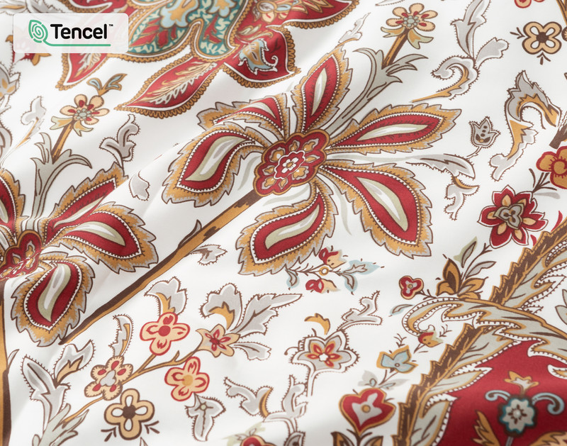 Close-up of the surface on our Porto Duvet Cover to show its glamorous red & paisley design.