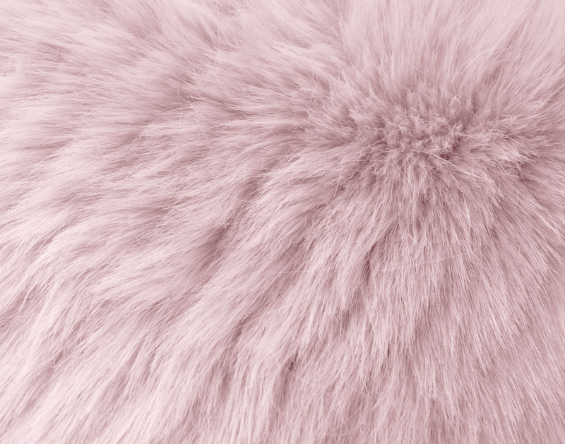 Close-up on the soft faux fur and light ribbing on our Angora Boudoir Cushion Cover in Camellia Pink.