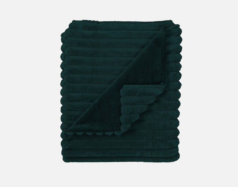 Our Ribbed Faux Fur Throw in Deep Sea folded into a tidy square against a solid white background.