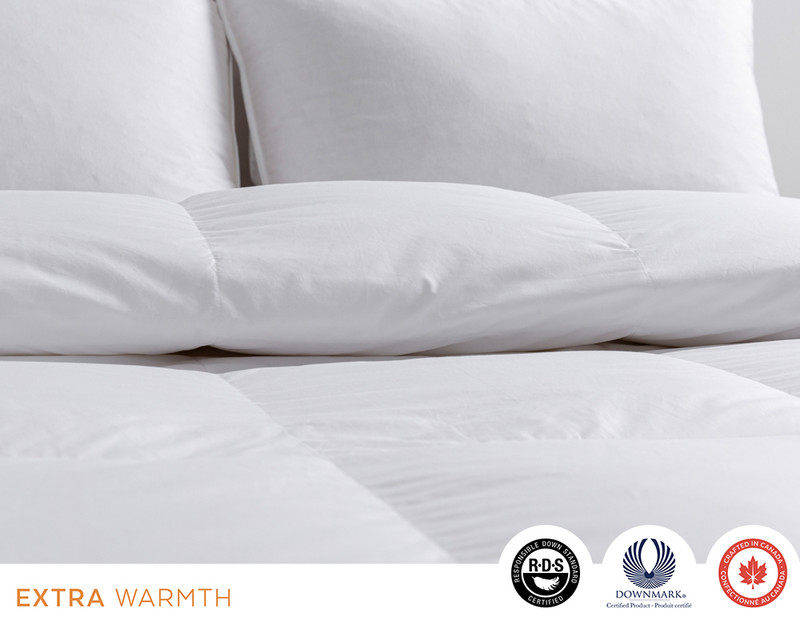 Folded edge of our Imperial Hungarian White Goose Down Duvet to show its double piped border and lofty fill.