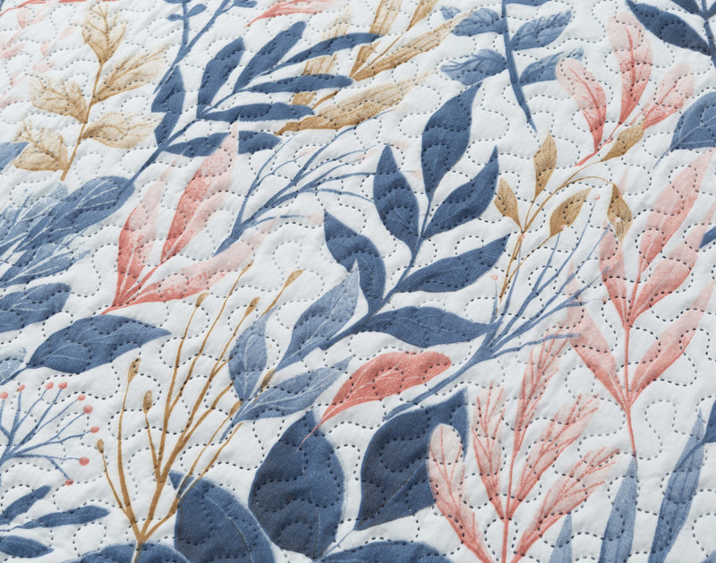 Close-up on the botanical leaf pattern on our Landry Coverlet Set.
