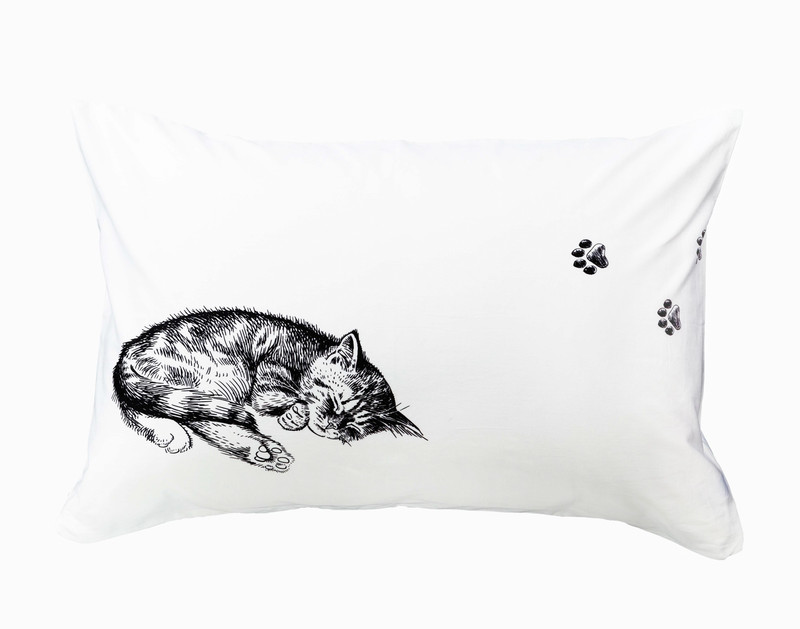 One of our Sleeping Cat Pillowcases featuring a design of a sleeping kitten curled into a ball.