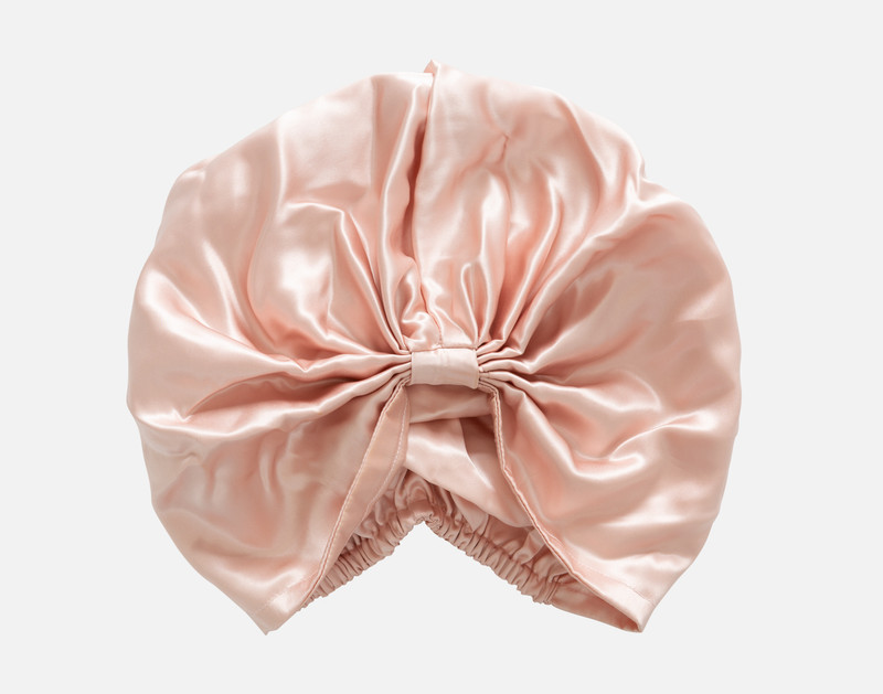 Top view of our Mulberry Silk Hair Wrap in Blush sitting against a solid white background.