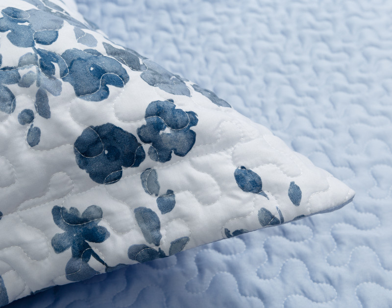 Close-up on the flanged edge corner on a pillow sham for our Periwinkle Coverlet Set.