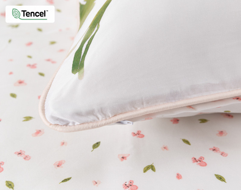Close-up on the blush piped border on the corner of our Gala Pillow Sham.