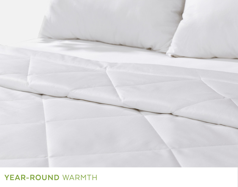 Angled view of the rolled up top edge on our Kapok Komfort Duvet to show its natural softness.