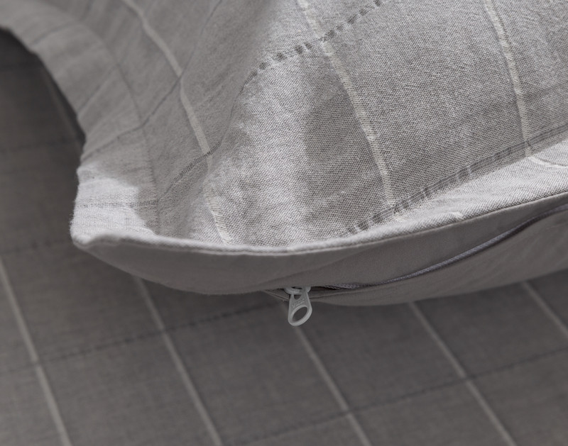 Close-up on the zipper enclosure on the back of our Checkmate Pillow Sham.