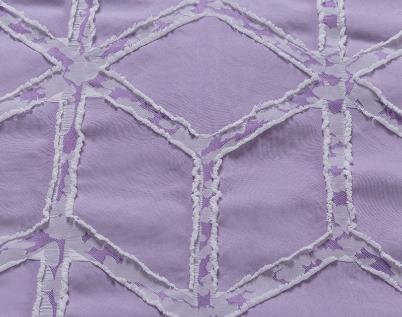 Close-up on the flat surface of our Prism Recycled Microfiber Comforter Set in Lilac to show its textured geometric pattern.