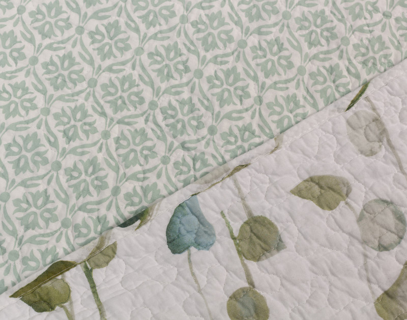Close-up on the edge on our Emry Cotton Quilt Set folded to show the front and reverse patterns.