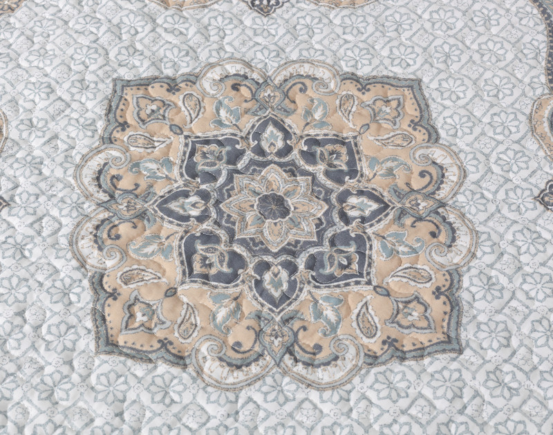 Close-up on the medallion design on the surface of our Arleigh Coverlet Set.