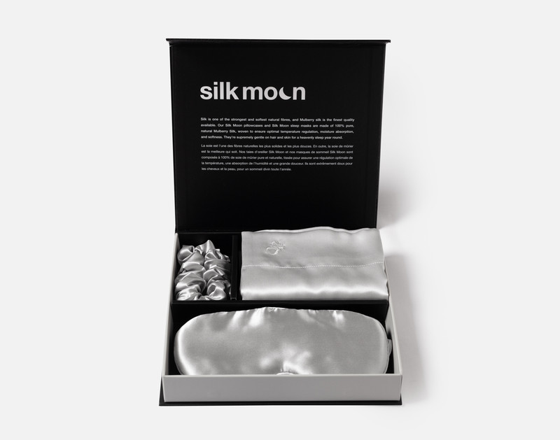 Front view of our unboxed Mulberry Silk Gift Set in Silver featuring a silk eye mask, pillowcase, and scrunchie.