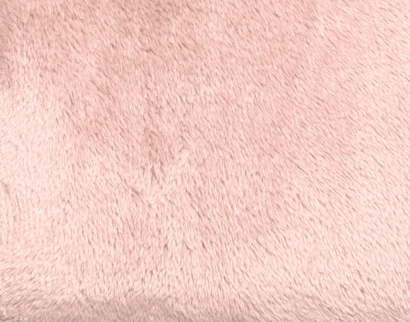 Gros plan sur notre peluche Velvet Jeté en Peony pour montrer sa douce texture veloutée.