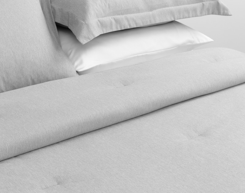Rolled up top edge on our Heathered Jacquard Comforter Set in Grey folded for a tidy bedroom look.