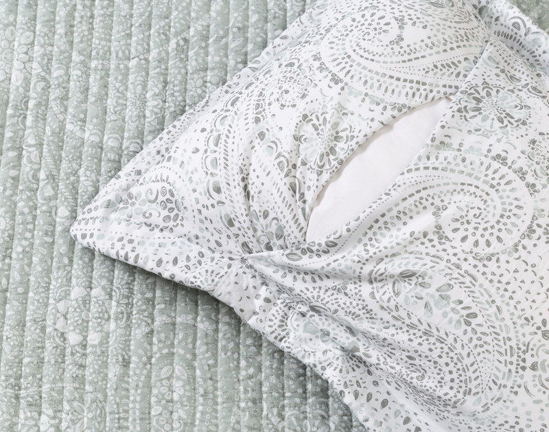 Reverse of our Tello Coverlet Set to show its coordinating white paisley backing and envelope enclosure.