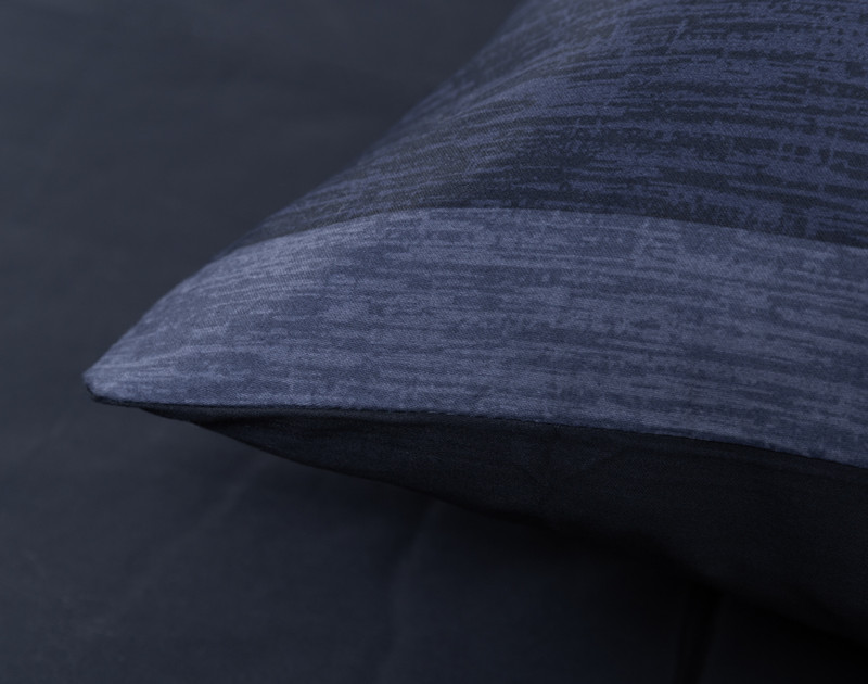 Close-up on the corner of our Knowlton Cotton Comforter Set to show its knife edged border.