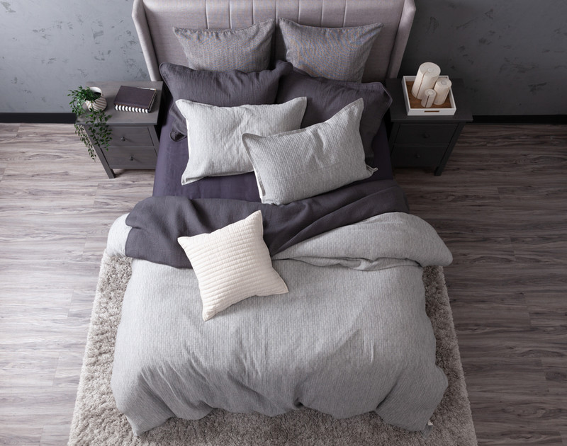 Top view of our Ancora Duvet Cover styled with accessories.