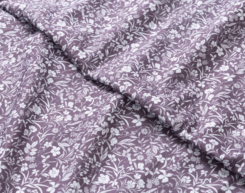 Close-up of scrunched up fabric on our Recycled Microfiber Sheet Set in Amelia to show its smooth and soft texture.