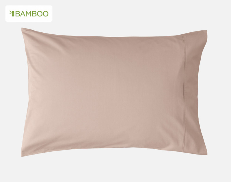 Front view of one of our Bamboo Cotton Pillowcase in Frosted Berry Pink sitting against a solid white background.