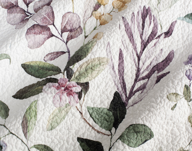 Close-up on the light purple florals and green vines on our Simone Cotton Quilt Set.