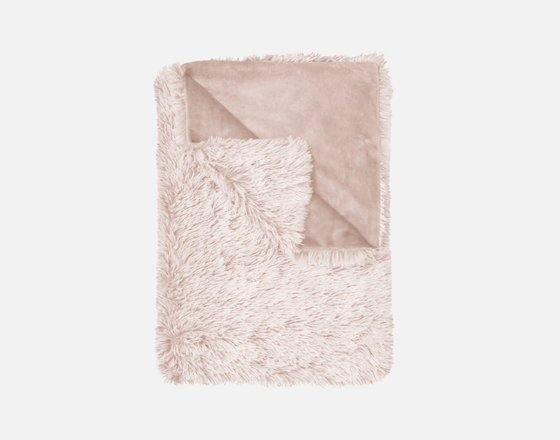 Top view of our Frosted Shaggy Throw in Woodrose folded into a tidy square.