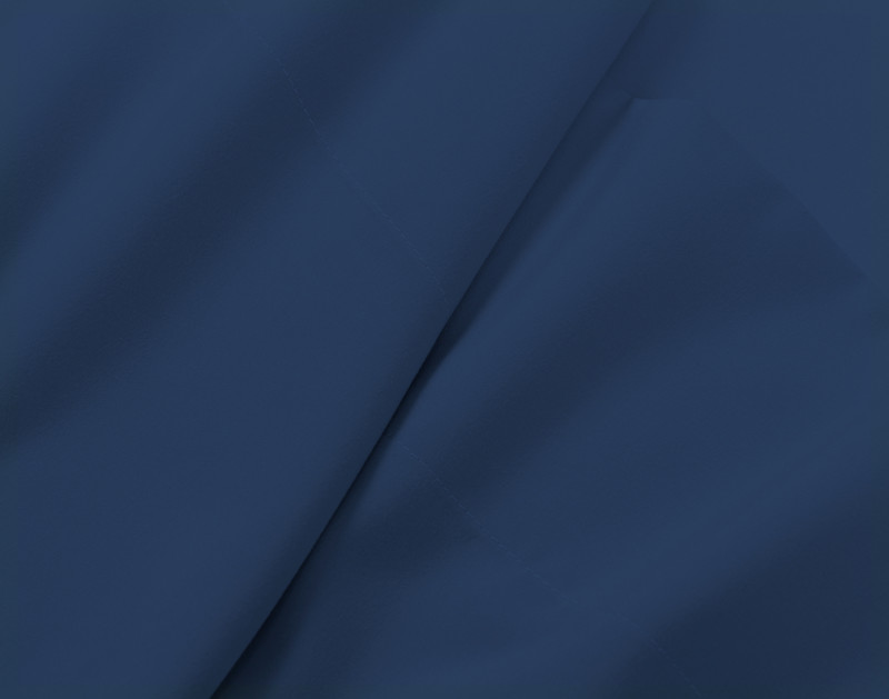 Close-up of some ruffled fabric on our Recycled Microfiber Sheet Set in Denim to show its smooth and soft texture.