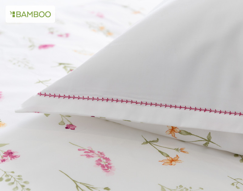 Close-up on our  Adelaide Pillow Sham to show its magenta hemstitched border on its corner.
