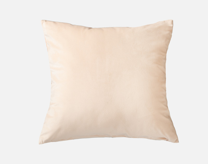 Back view of our Freya Square Cushion Cover to show its peach velvet reverse sitting against a solid white backdrop.
