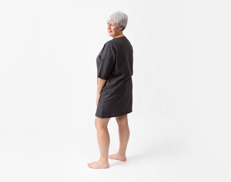 Back view of a woman wearing our Linen Blend Lounge Tunic in Black Pearl.