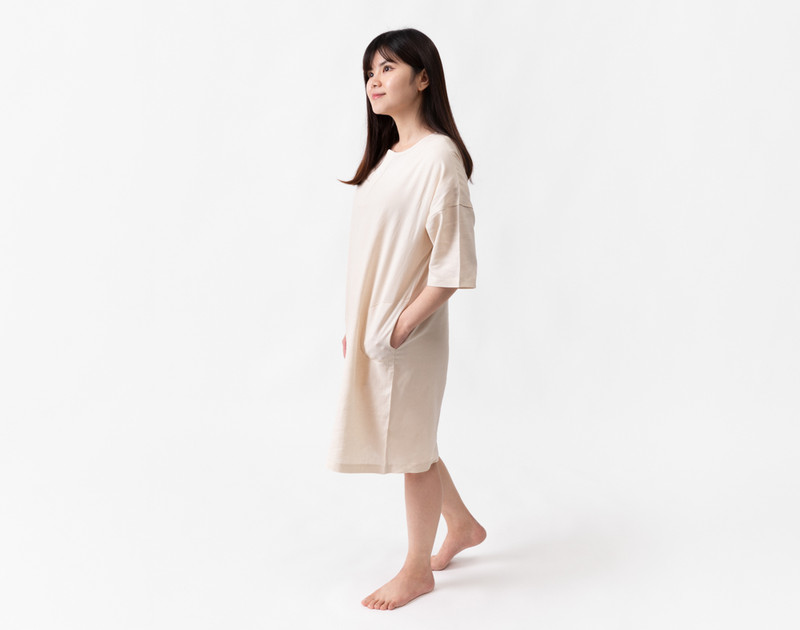 Side view of a woman wearing our Linen Blend Lounge Tunic in Stone.