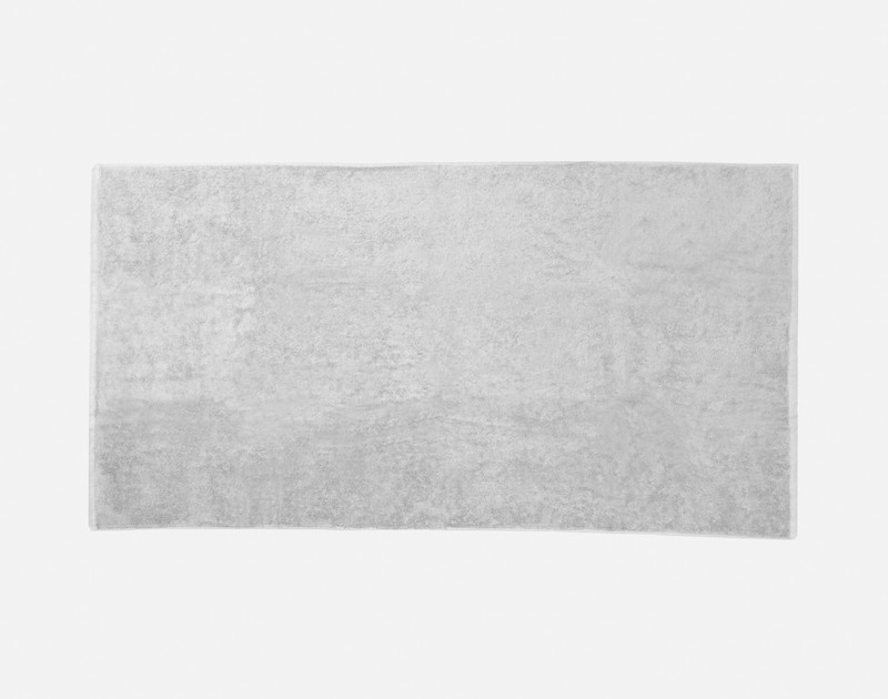 Top view of our Modal Cotton Bath Towel in Silver laying flat over a solid ground.