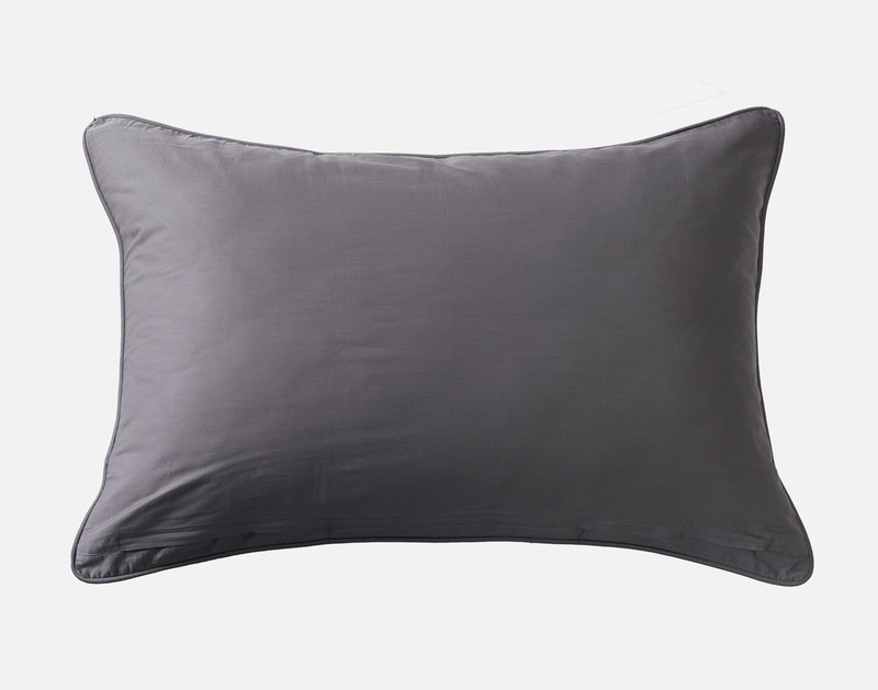 Front view of the solid reverse of our Porter Pillow Sham resting against a solid white background.