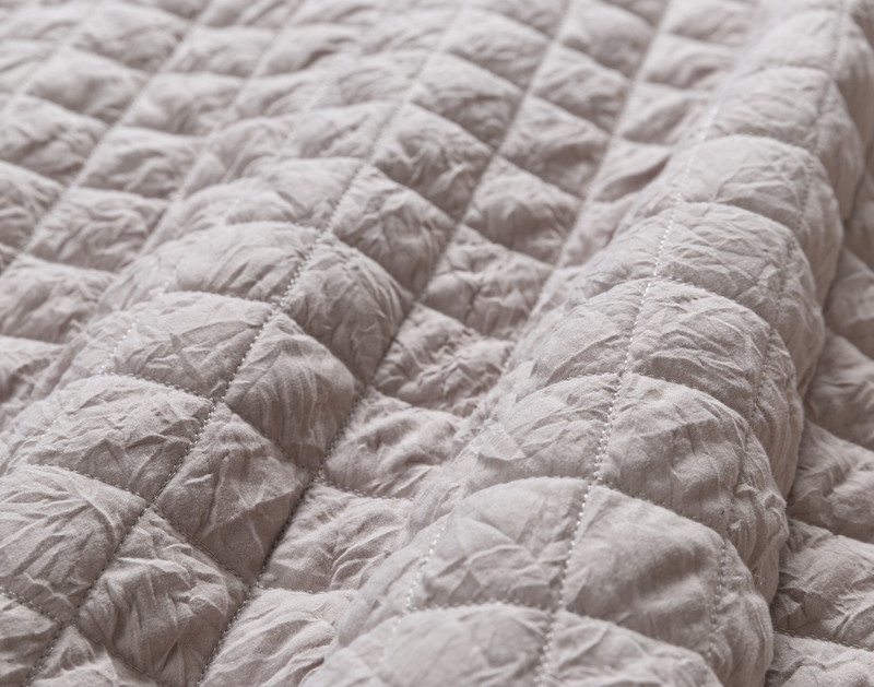 Close-up of the diamond stitching over our Rumple Crumple Coverlet Set in Ash.