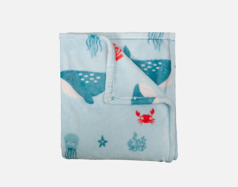 Close-up of our Whaley Kids' Fleece Velveteen Throw folded into a tidy square.