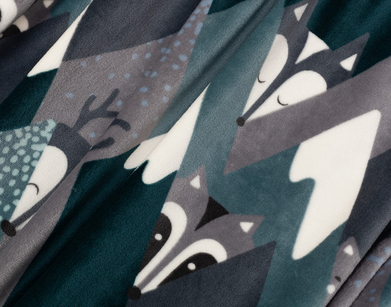 Close-up on the alternating forest animal and mountain peaks on our Mountain Animals Kids' Fleece Velveteen Throw.