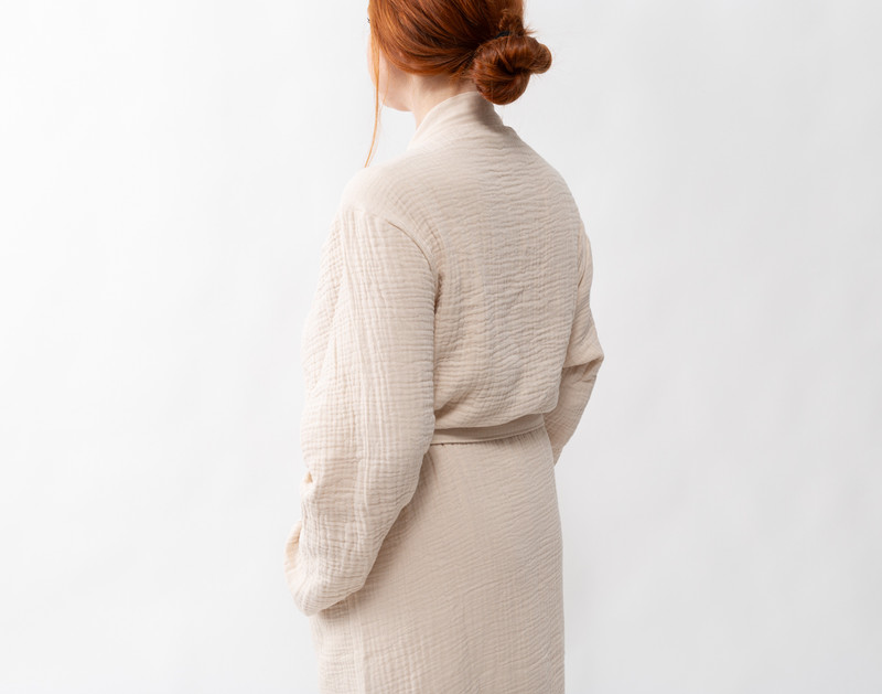 Back view of a woman wearing our Muslin Gauze Bathrobe in Natural.