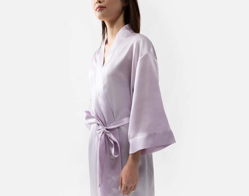 Side view of our Lavender Silk Kimono Robe being worn by a young woman.