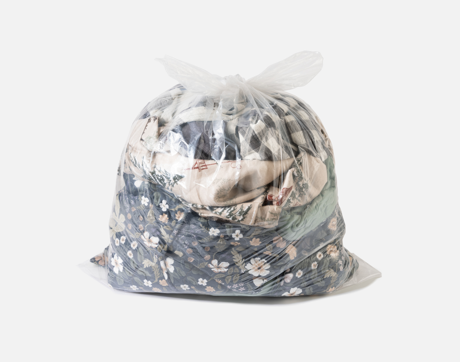 Bag containing a loose pile of ruffled fabric to be recycled.