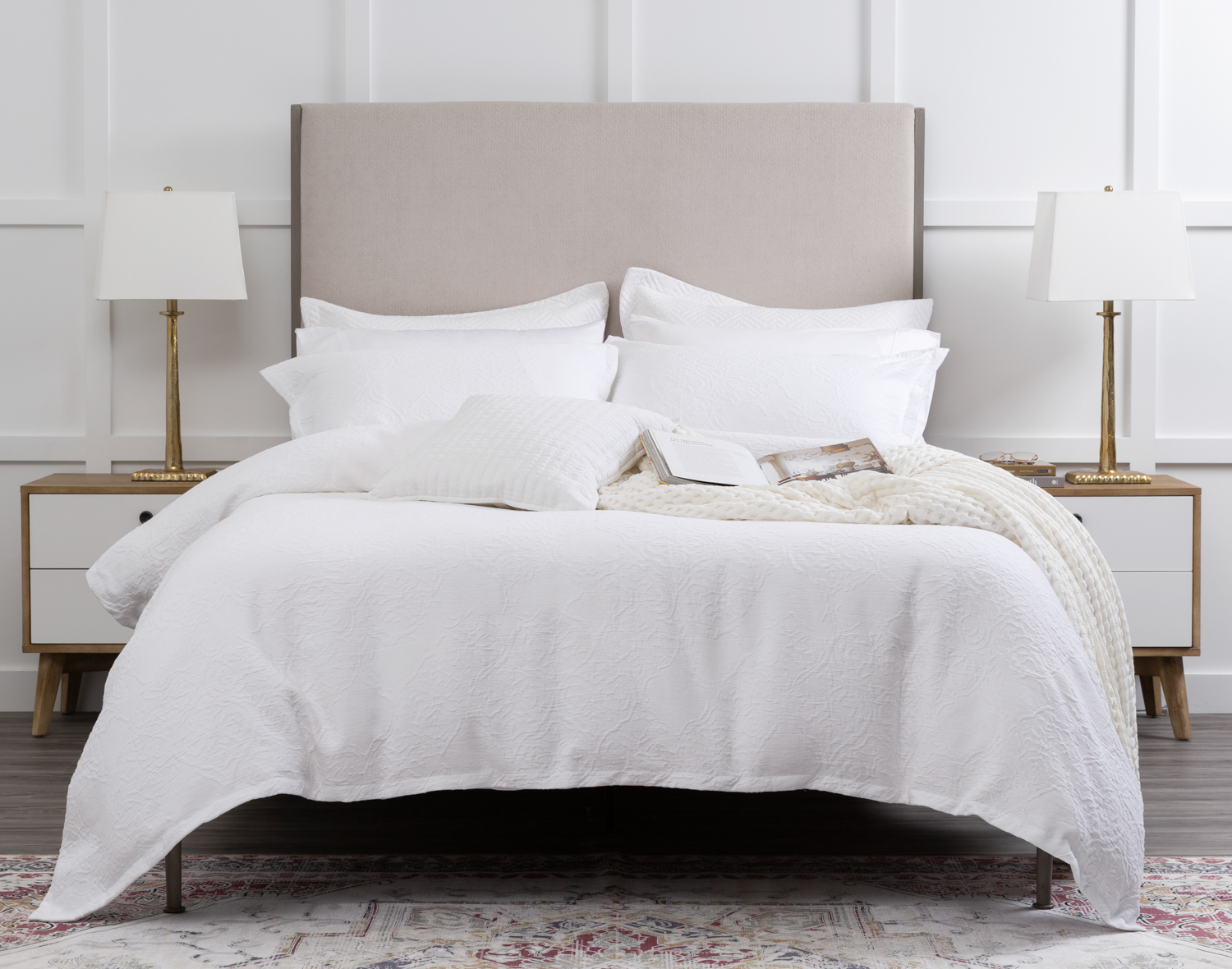 Front view of our Corinthia Duvet Cover dressed over a bed in a white bedroom.