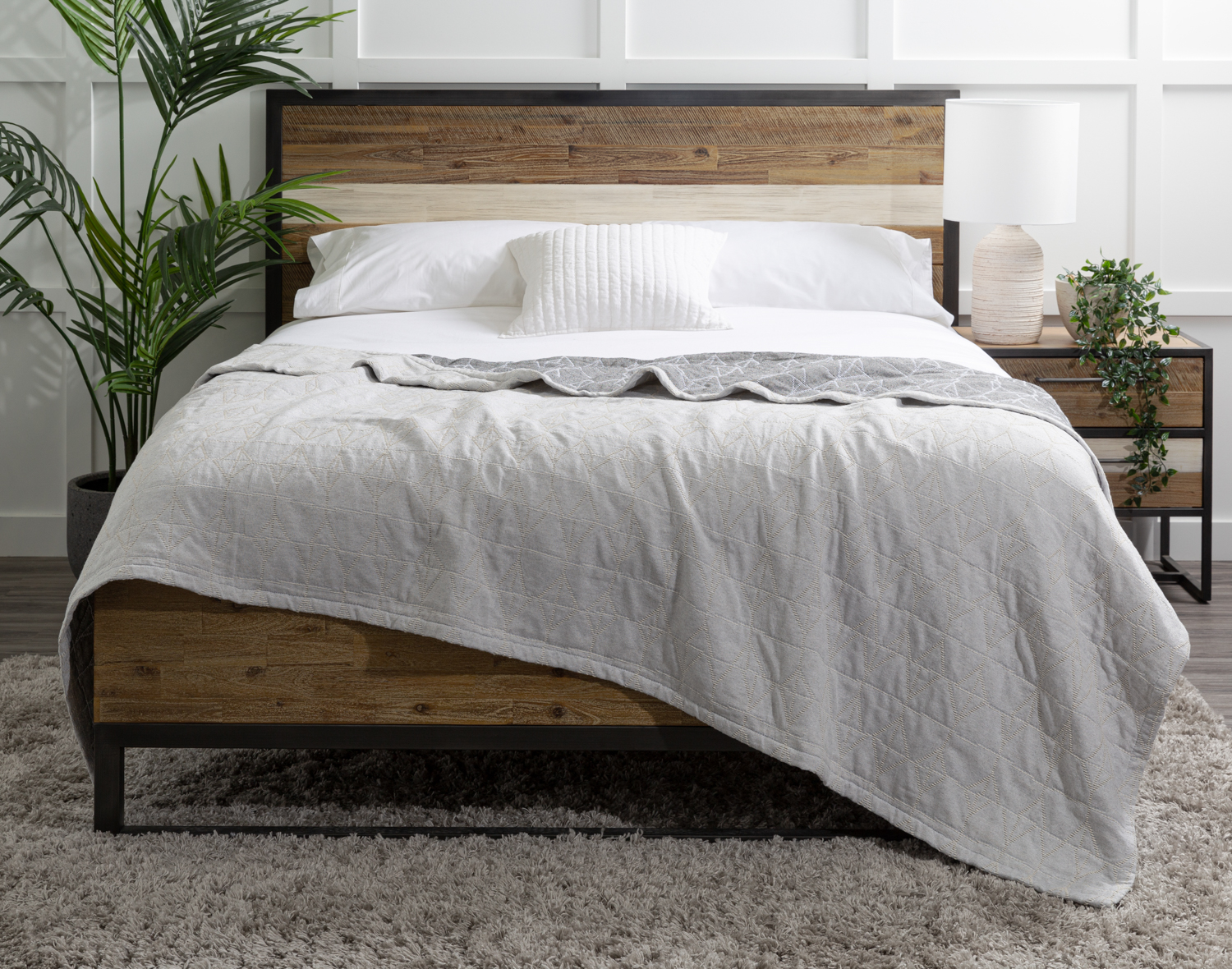 Front view of our Bragado Blanket draped unevenly over a bed.