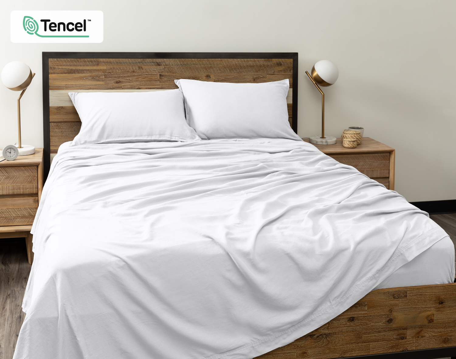 Front view of our Hemp Touch Sheet Set in White dressed over a queen bed with matching flat sheet, pillowcases, and fitted sheet.