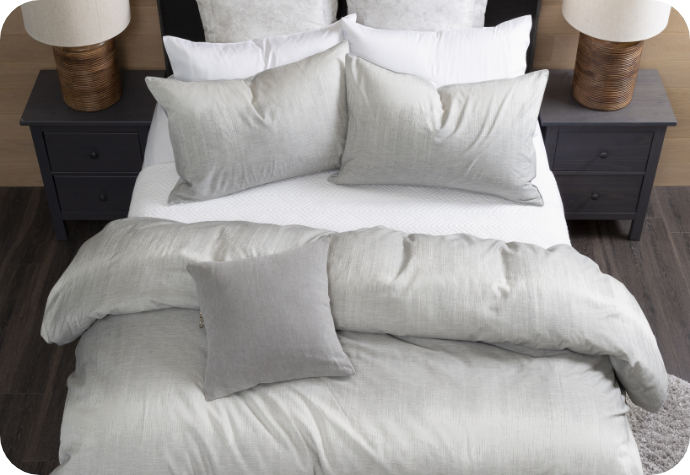 View from above of the Benito Duvet Cover dressing a bed complete with white sheets and matching pillows.