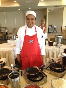 A chef in a kitchen Description automatically generated with medium confidence