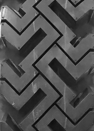 Bobcat 825 - 7.50x16 (7.50-16) OTR 10-Ply Skid Steer Heavy Duty Tire Mounted on Gloss Black Rims