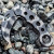 Smith & Wesson Extreme Ops Camo 440 Folding Karambit shown halfway open with titanium powder-coated blade partially deployed