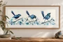 Blue Wren Fleeting Moments Australian bird watercolour artwork by Leni Kae displayed in a natural timber frame with white mat board on a cream wall.